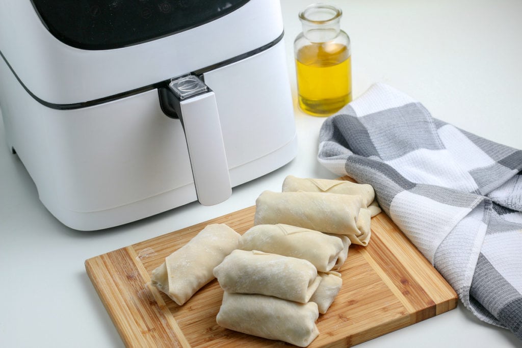 egg rolls in front of air fryer
