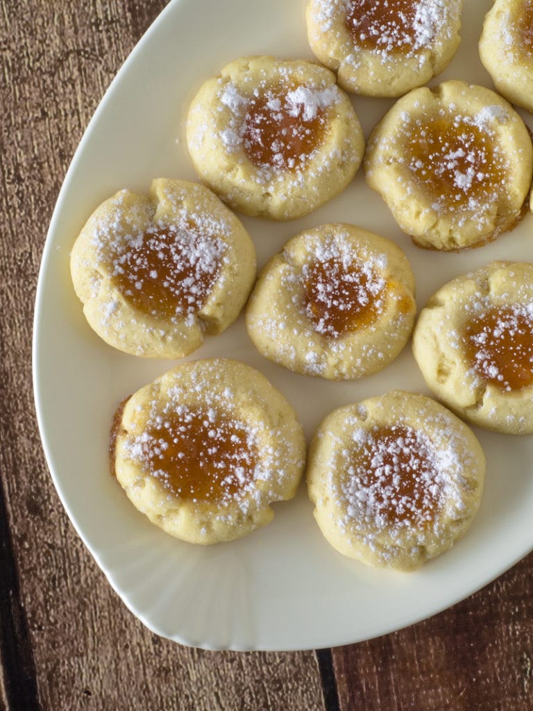 top view of jam thumbprint cookies on a plate