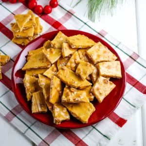 peanut brittle on a red plate