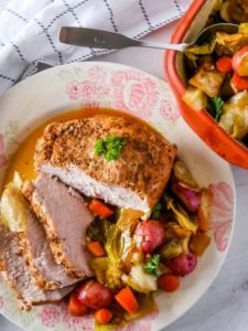 pork loin on a plate with vegetables