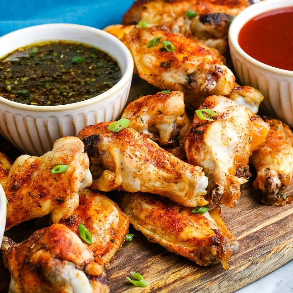 chicken wings on a wooden cutting board