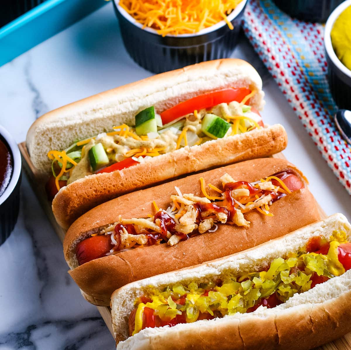 close up of hot dogs on a tray