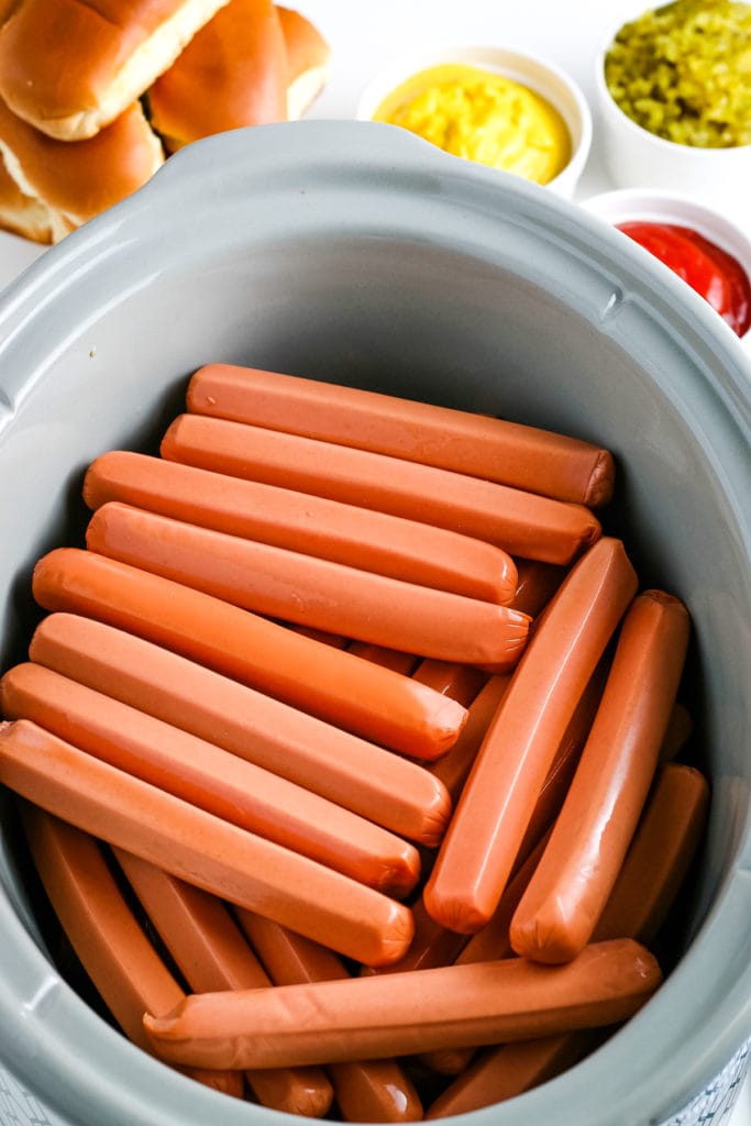 putting hot dogs in the crock pot