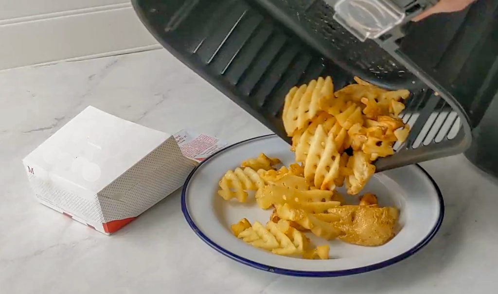 dumping fries out of air fryer