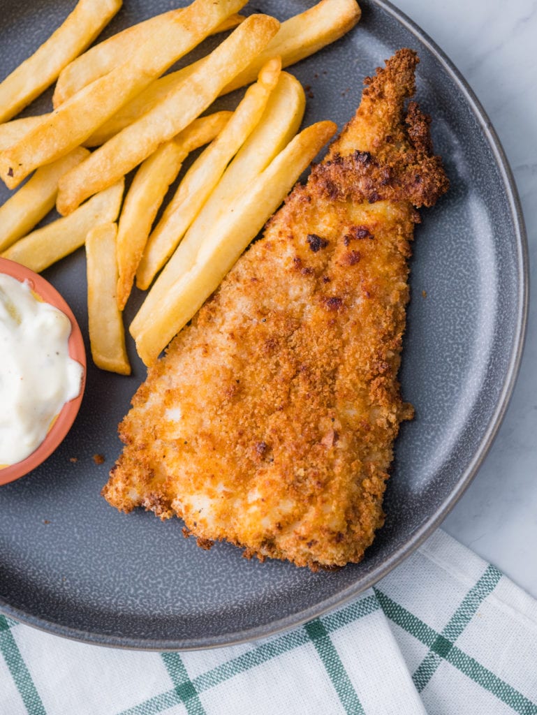 top view of air fryer fish and chips on a plate