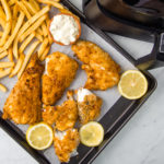 air fryer fish and chips in front of air fryer