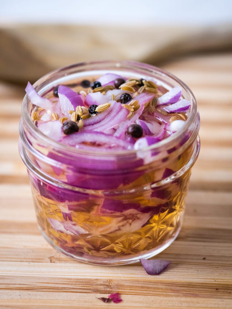 close up of jar of Mexican pickled onions