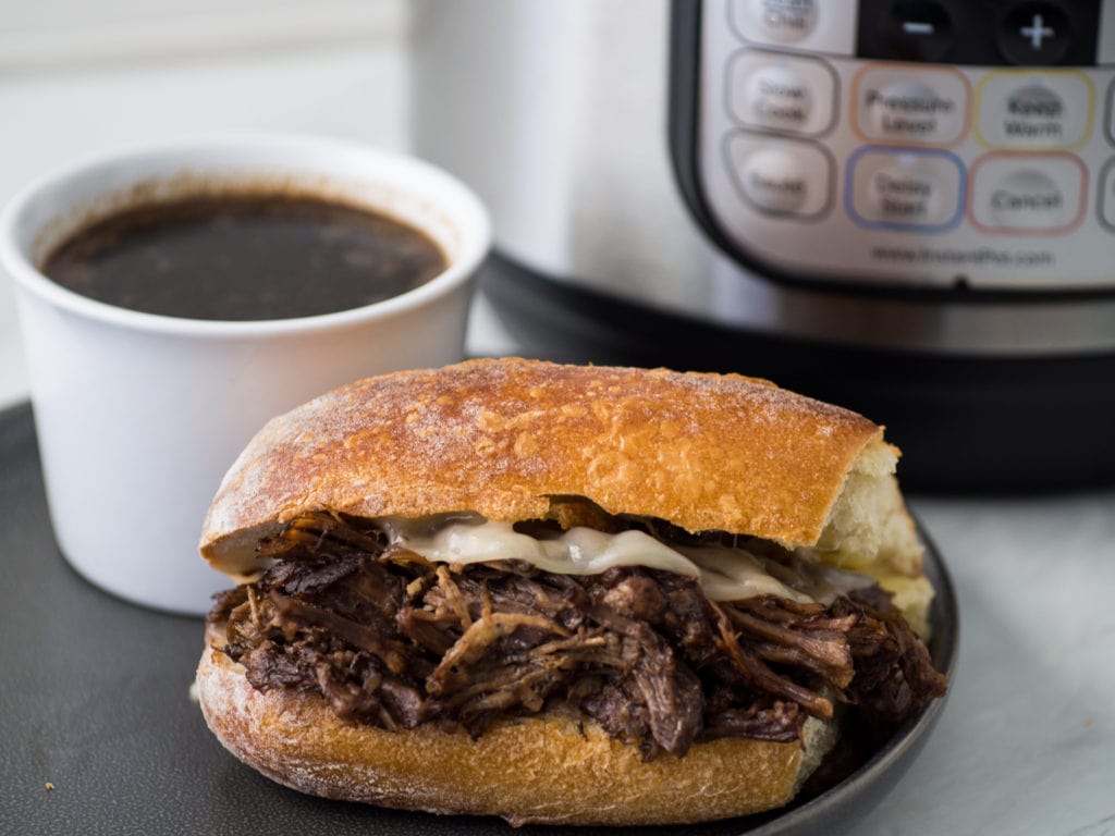 French dip sandwich in front of Instant Pot