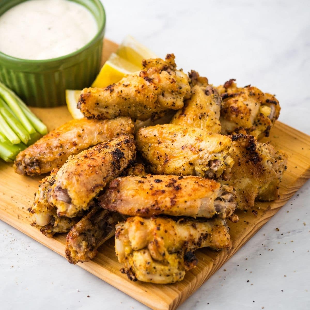 lemon pepper wings on a cutting board ready for serving
