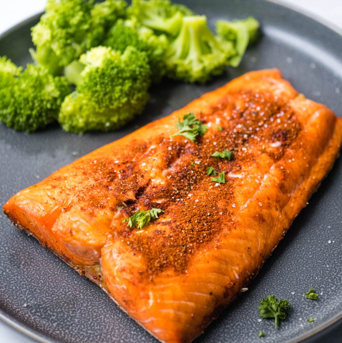 salmon on a plate with brocolli