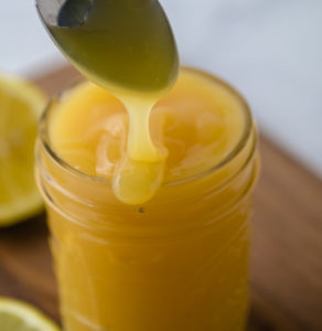 spoon with dripping lemon curd