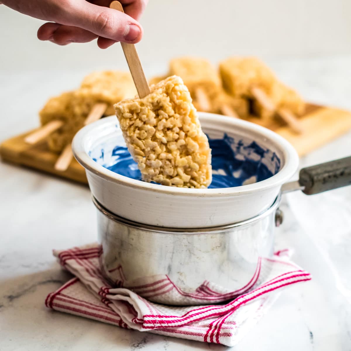 dipping the rice krispie pops