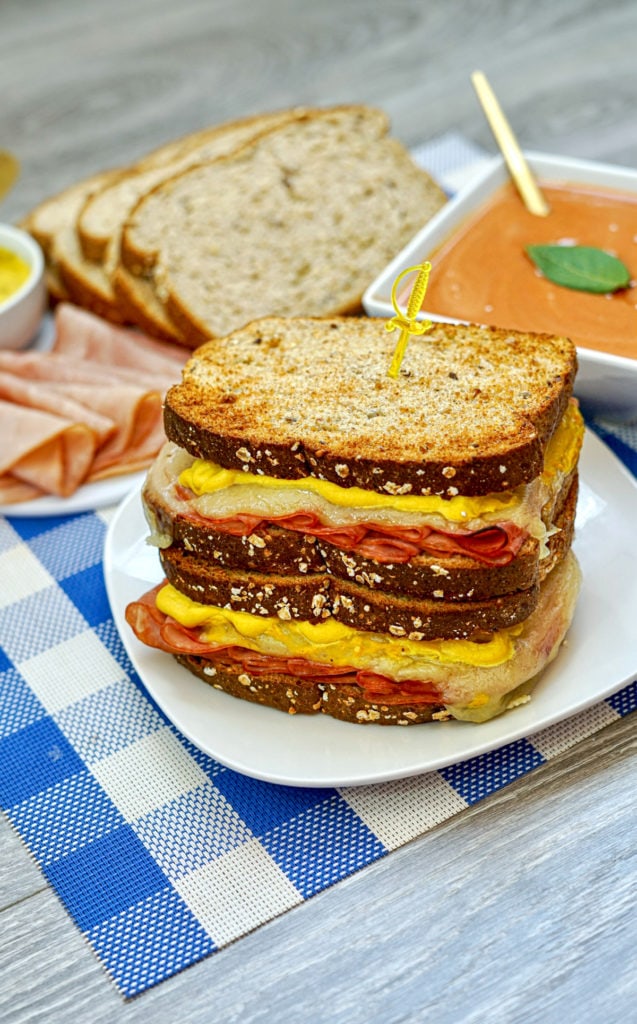 stack of grilled ham and cheese sandwiches