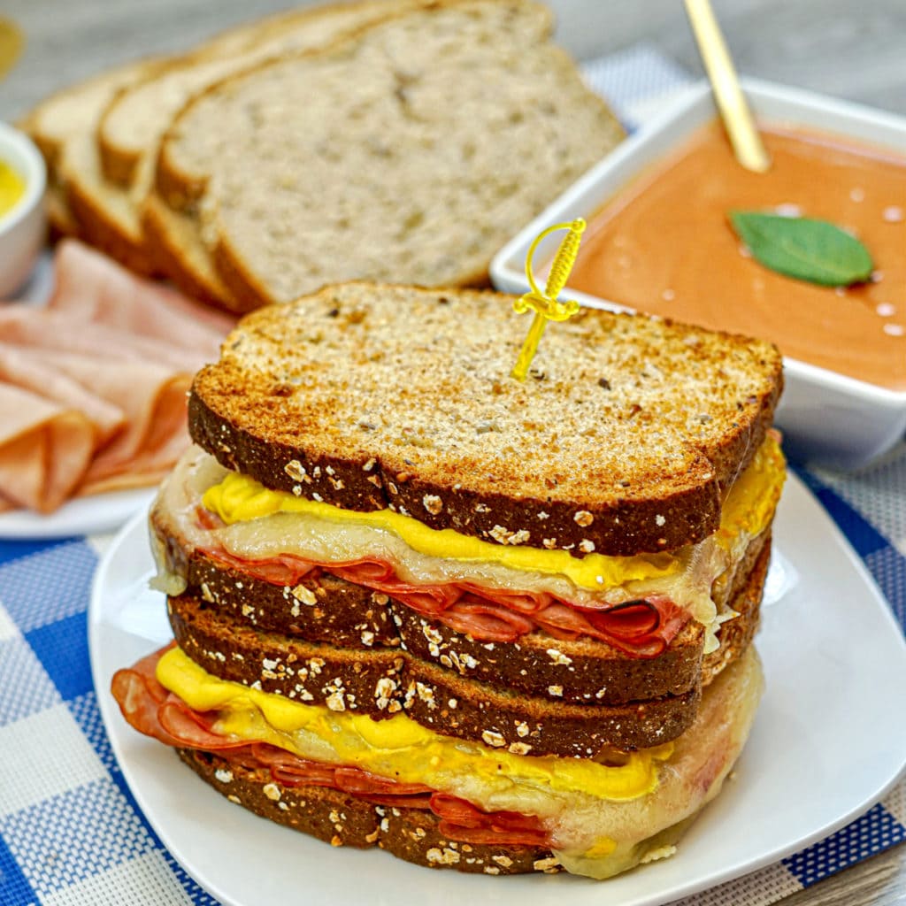 closeup of grilled ham and cheese sandwiches