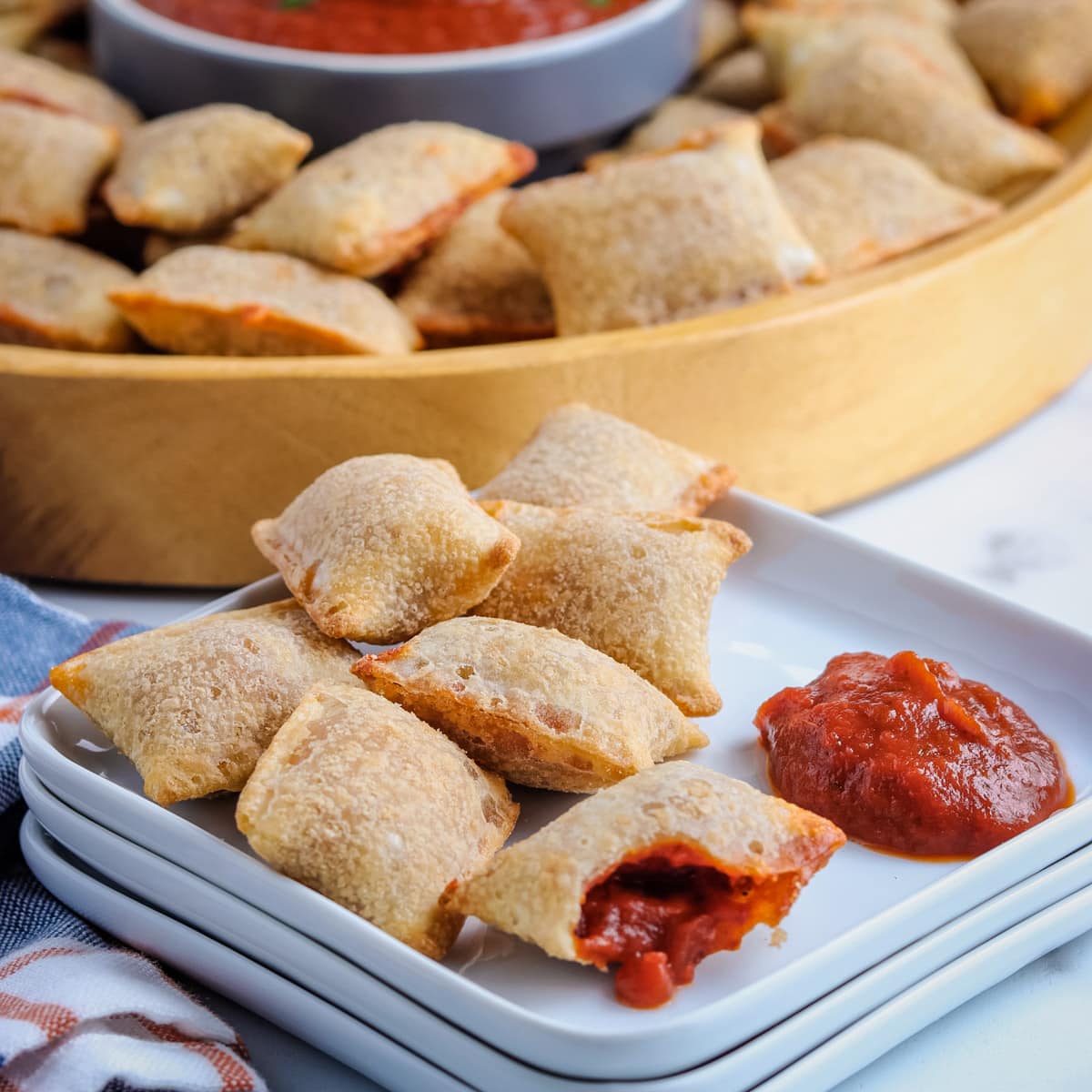 plate of pizza rolls with one open
