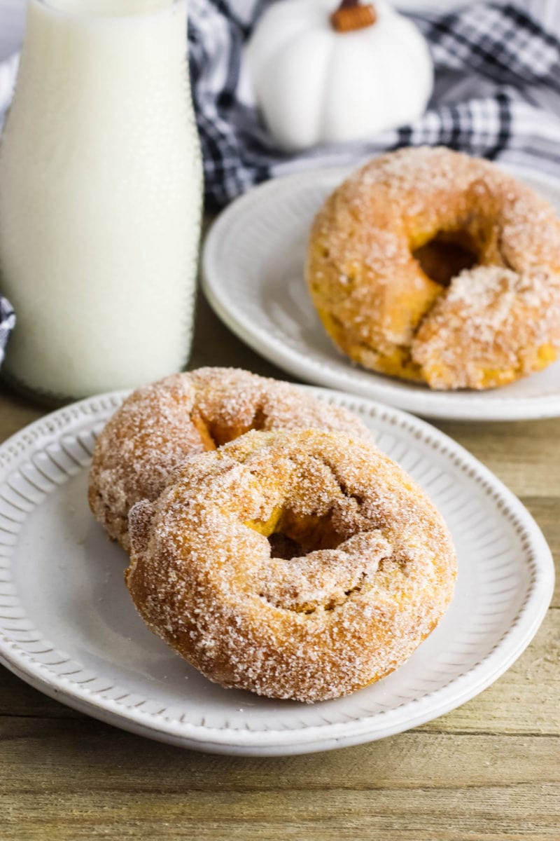 air fryer pumpkin donuts coated with sugary coating