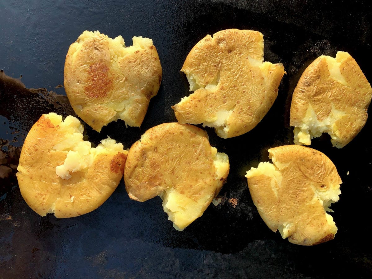 potatoes frying on a griddle