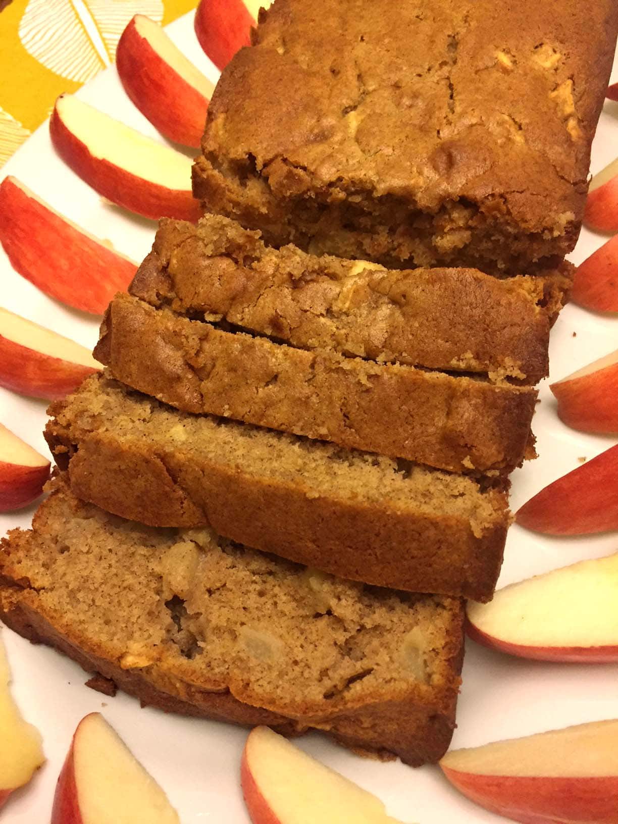 cinnamon apple bread surrounded by apples