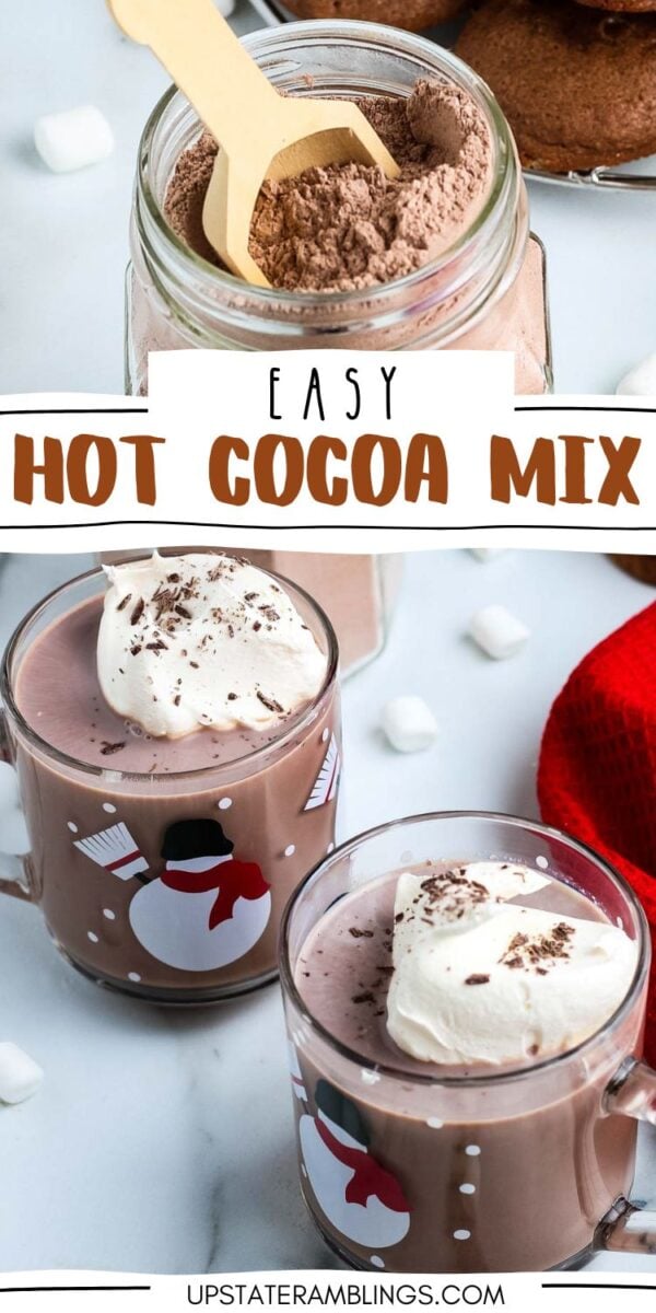 Jar of homemade hot chocolate mix with a wooden spoon, and two mugs of hot cocoa topped with whipped cream and chocolate shavings, surrounded by marshmallows.