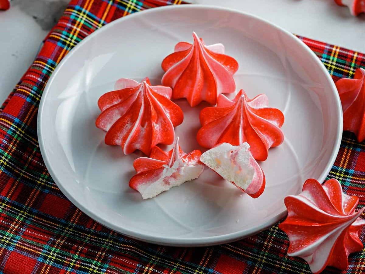peppermint meringues on a plate with one broken