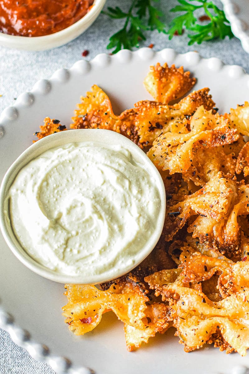 pasta chips on a plate with whipped feta dip