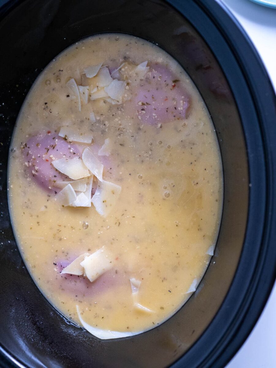 chicken in crock pot with dressing on top
