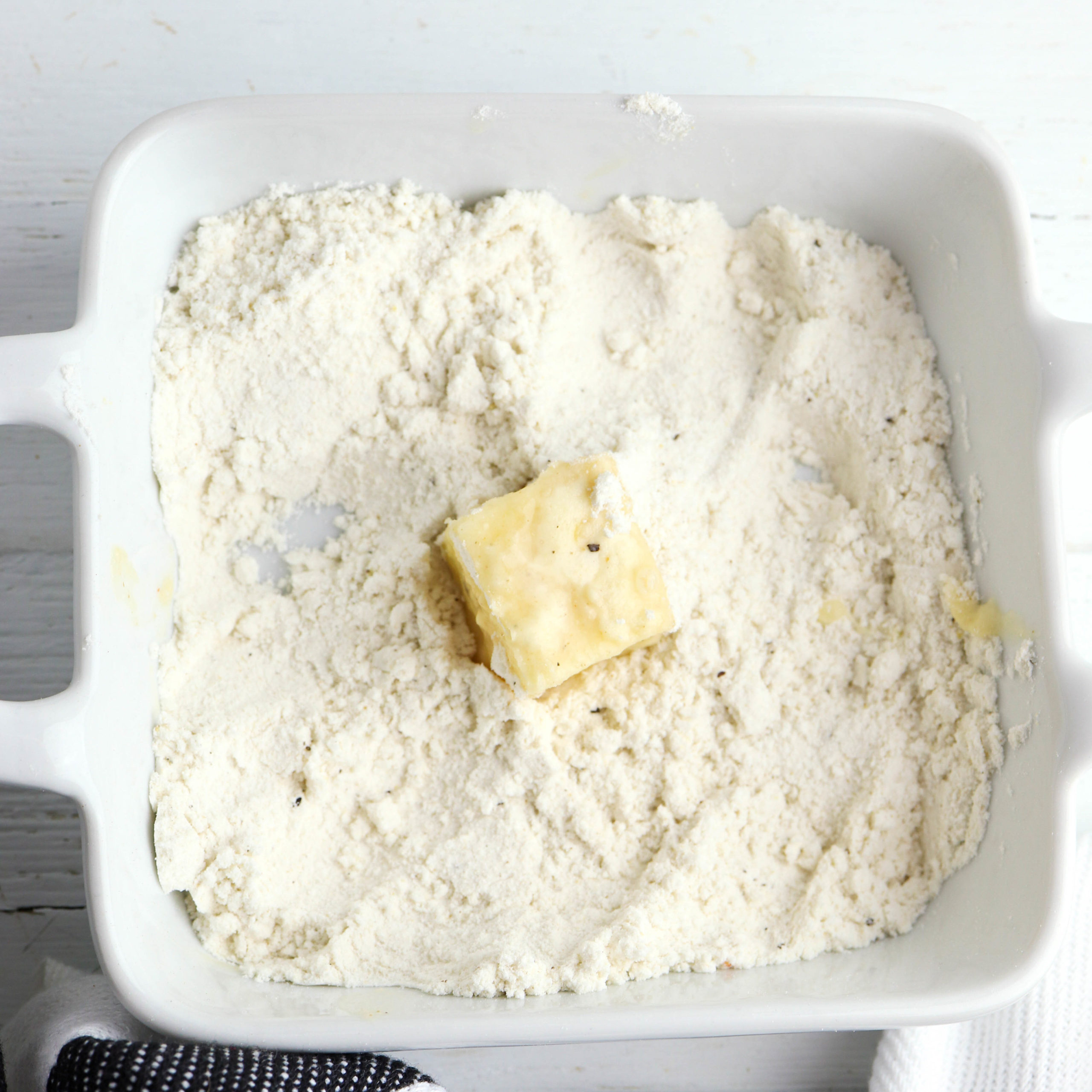 dipping the cheese in flour