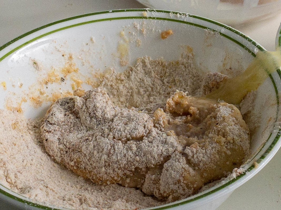 dipping the chicken in flour