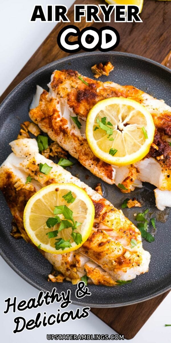 A dish of cooked cod made in an air fryer, topped with lemon slices and herbs. The text reads "AIR FRYER COD" at the top and "Healthy & Delicious" at the bottom.