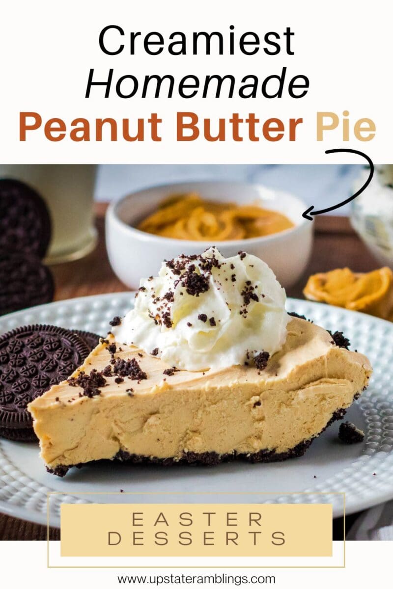 A slice of no bake peanut butter pie topped with whipped cream and chocolate cookie crumbs, with cookies and a bowl of peanut butter in the background.
