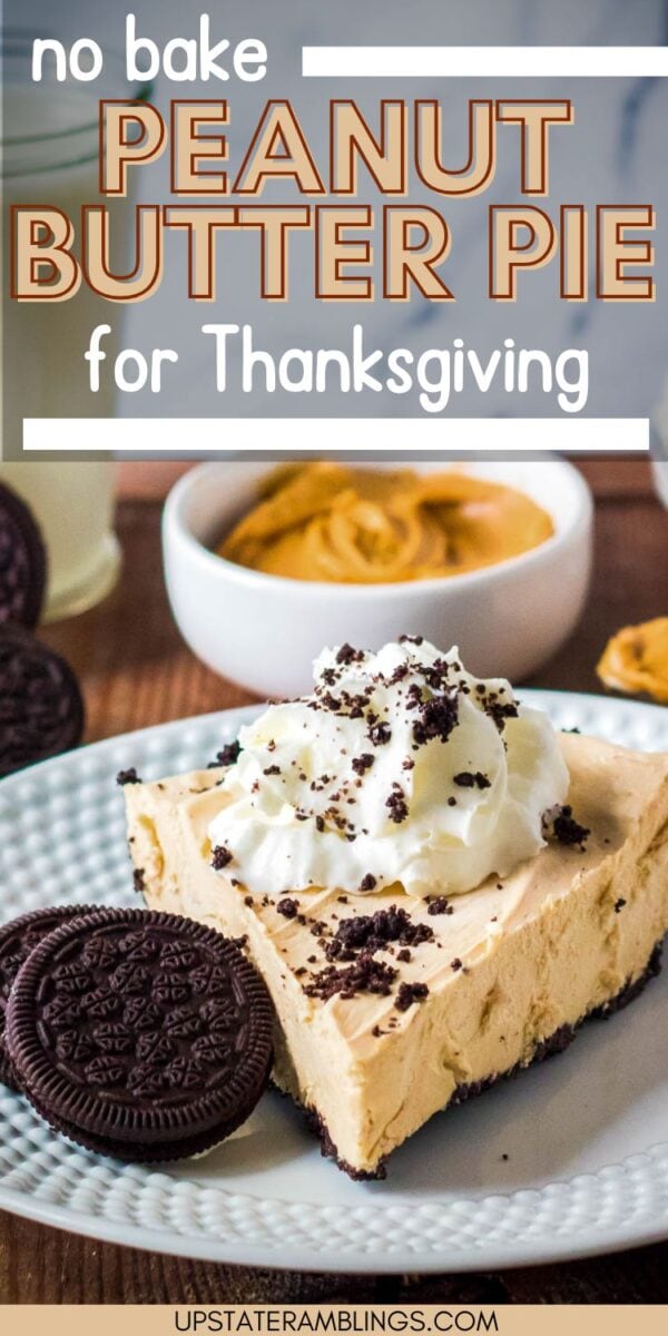A slice of creamy no bake peanut butter pie topped with whipped cream and cookie crumbs, served with Oreos and a bowl of peanut butter in the background.