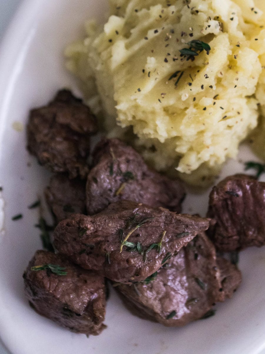 top view of steak bites with mashed potatoes