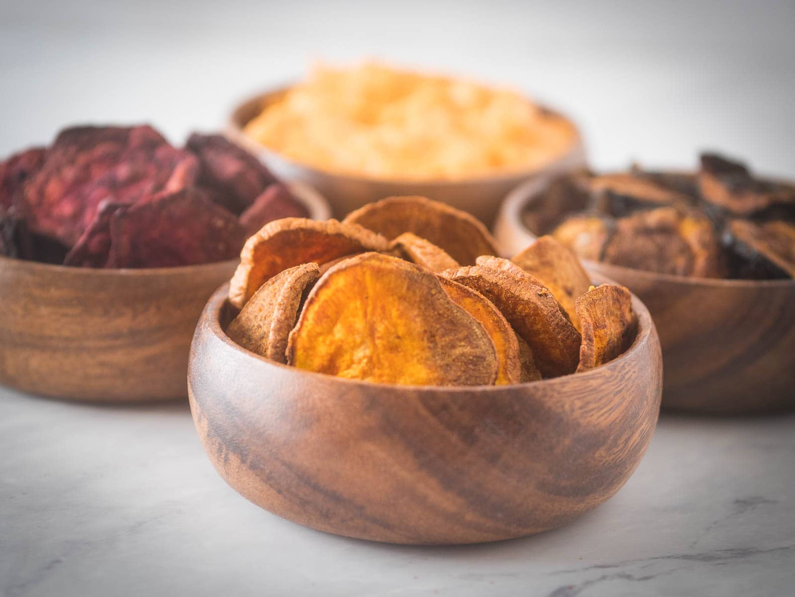 Sweet potato chips in wooden bowls.