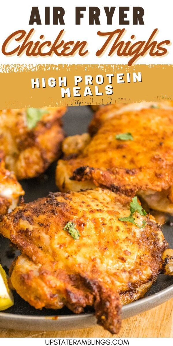 Close-up of crispy air fryer chicken thighs garnished with fresh herbs on a plate, highlighting high protein meals.