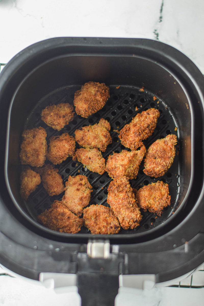 fried chicken nuggets in air fryer basket