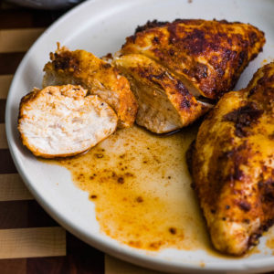 closeup of boneless chicken breast cooked in air fryer