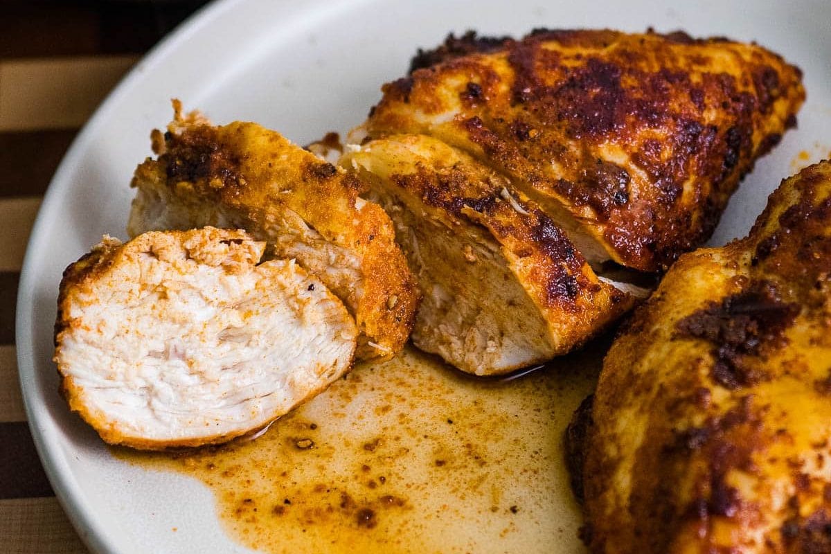 sliced air fryer chicken breast on a plate