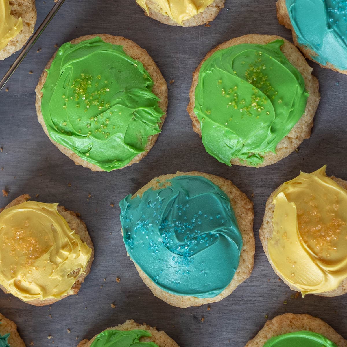 Sour cream cookies with blue, green and yellow icing.