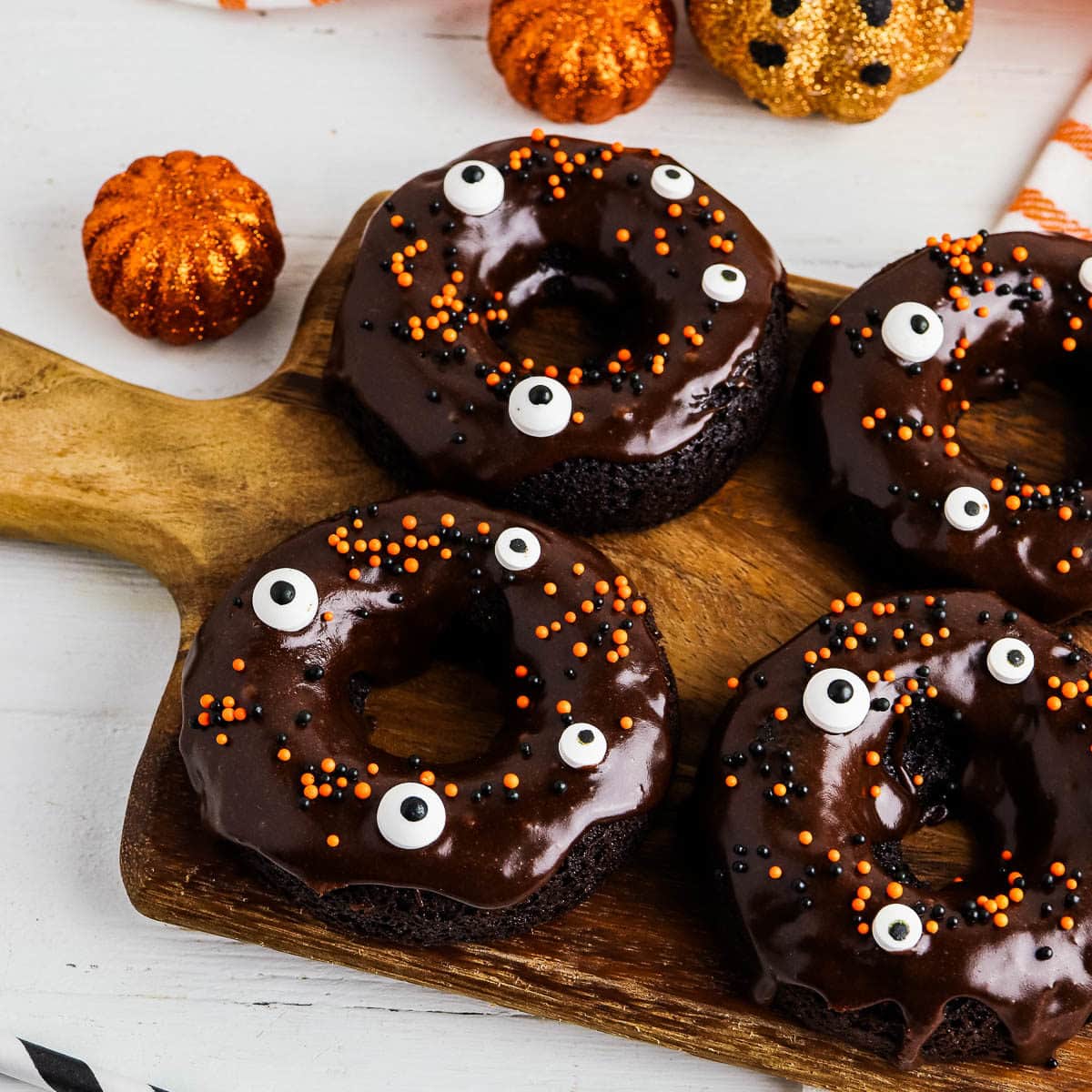halloween cake mix donuts on a cutitng board