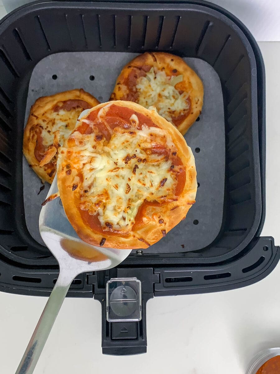 taking pizza out of air fryer