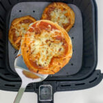 taking pizza out of air fryer