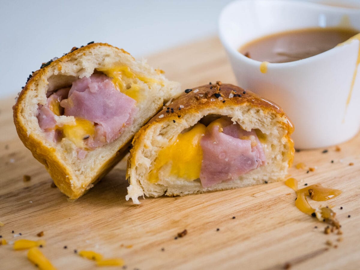 ham and cheese stuffed biscuit cut open to show filling