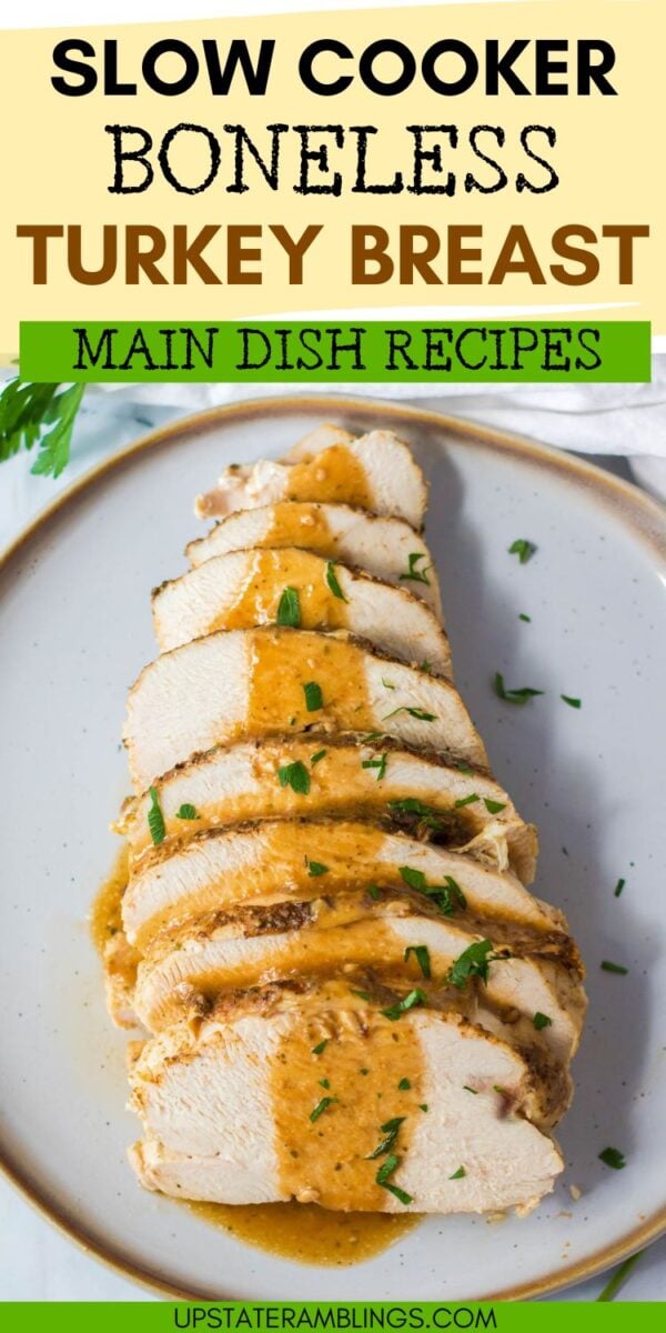 Sliced boneless turkey breast in crock pot, topped with rich gravy and garnished with herbs, served on a white plate.