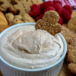 eggnog dip with a gingerbread cookie