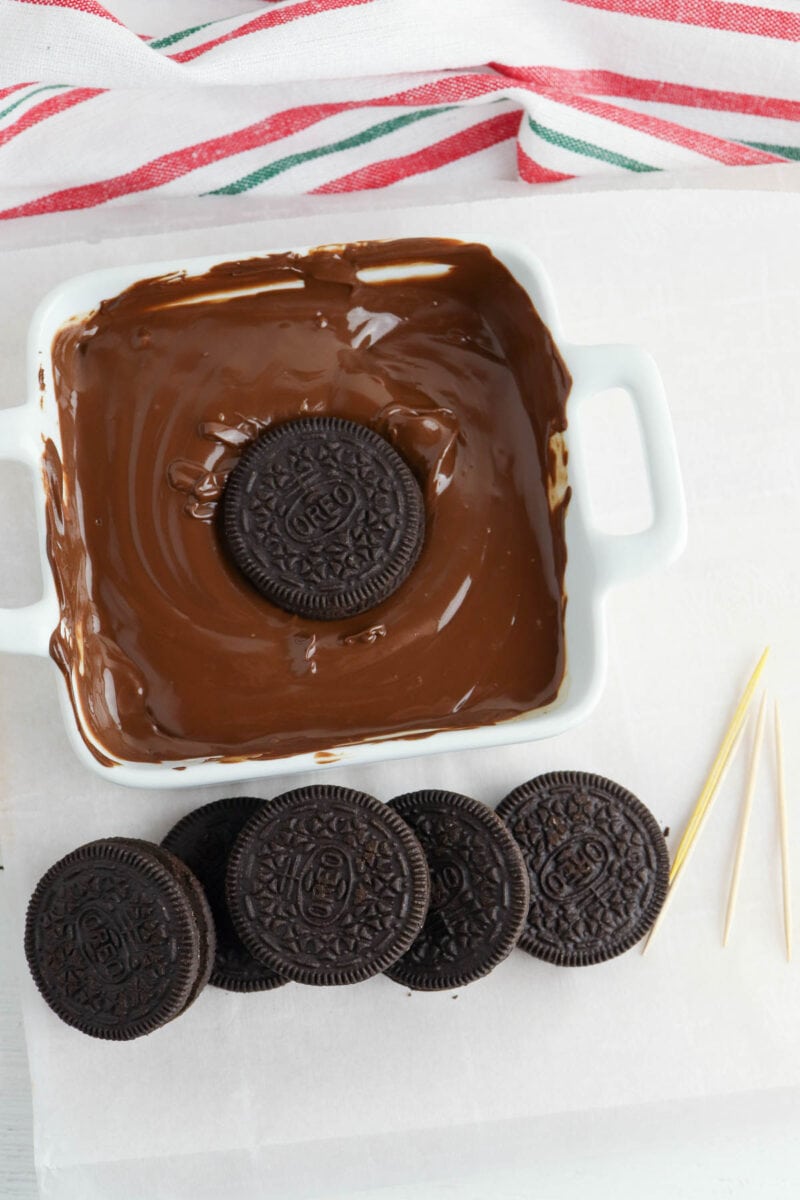 dipping the oreo in chocolate