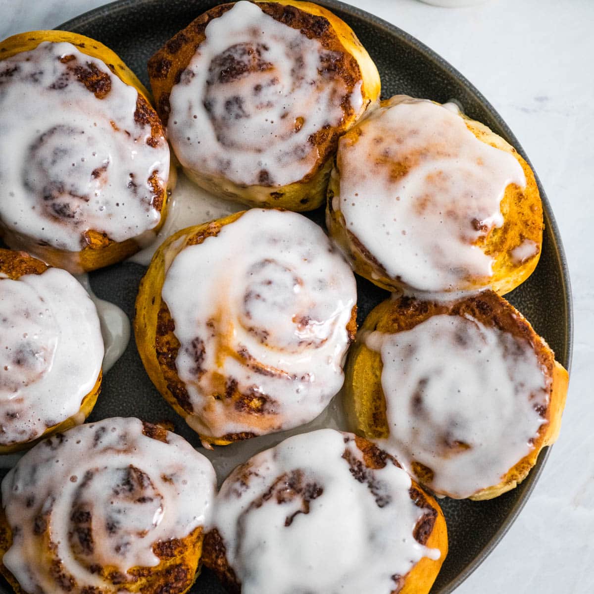 top view of frosted cinnamon rolls.