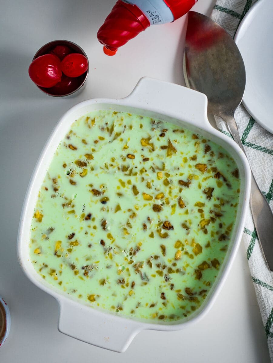 top view of green jello salad in a square dish.
