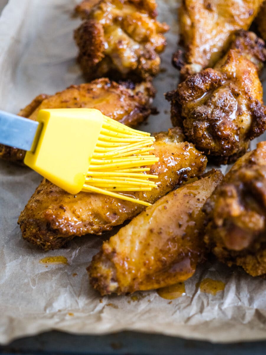 brush the wings with buttery sauce