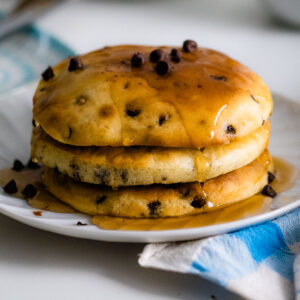 stack of air fryer pancakes with chocolate chips on a plate.