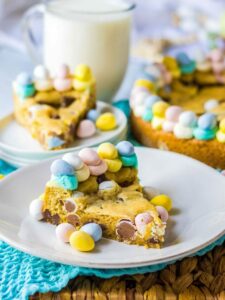piece of cookie cake on a plate with easter eggs.